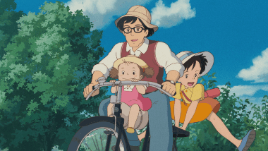 The Kusakabe family riding three-on-a-bike to Shichikokuyama Hospital.