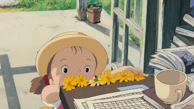 Mei playing 'flower shop' in her father's study, while her dad looks busy.