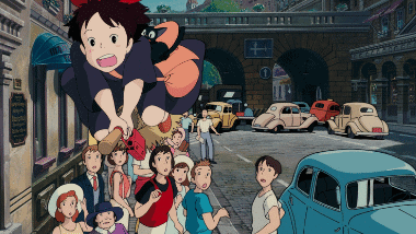 A bewildered Kiki losing control of her broom in a bustling town