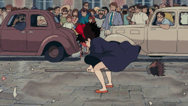 Kiki flying with a deck brush to rescue Tombo, who is hanging from the runaway airship