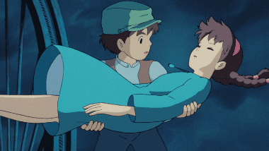 Pazu catching the girl who fell from the sky with a glowing stone on her chest.