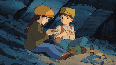 Pazu and Sheeta eating by the light of a lamp in the cave.