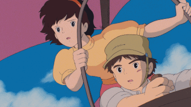 Pazu and Sheeta taking off in the kite from the roots of the giant tree.