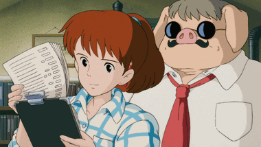Fio passionately explaining things at Piccolo S.p.A. while Porco listens intently.