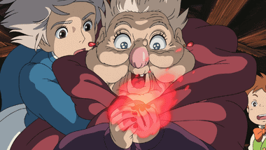 The Witch of the Waste reaching into the fire to grab Calcifer from the hearth, while Sophie tries to stop her