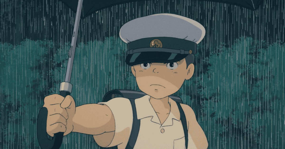Young boy holding an umbrella in heavy rain while wearing a cap and backpack