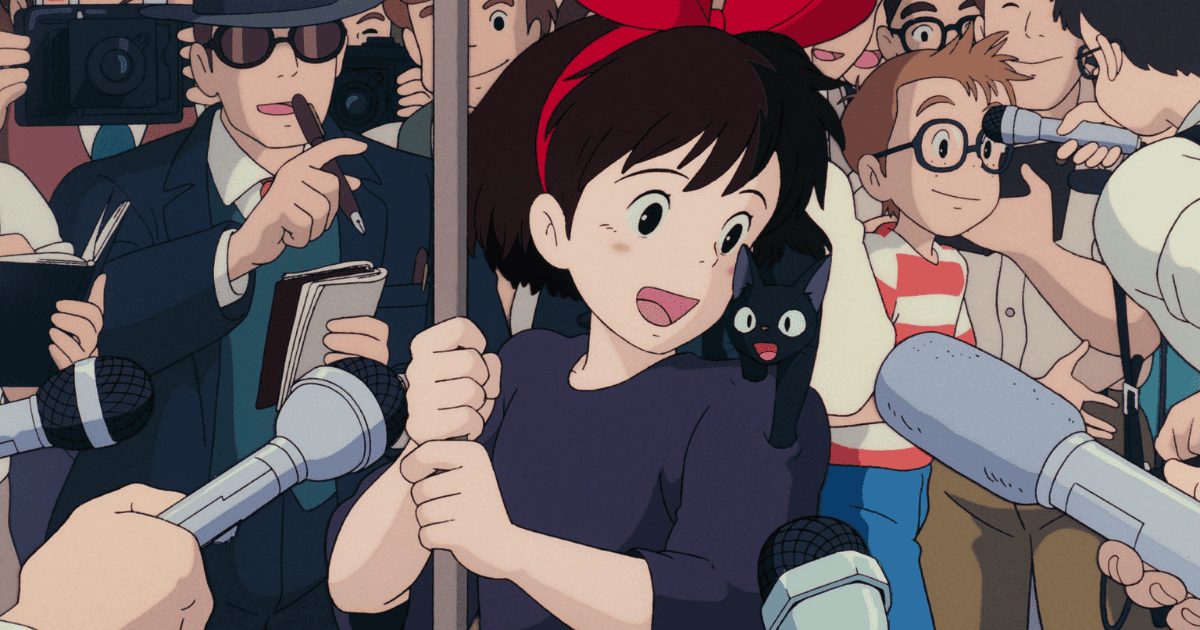 Young witch with a black cat surrounded by reporters, cameras, and microphones after a dramatic rescue