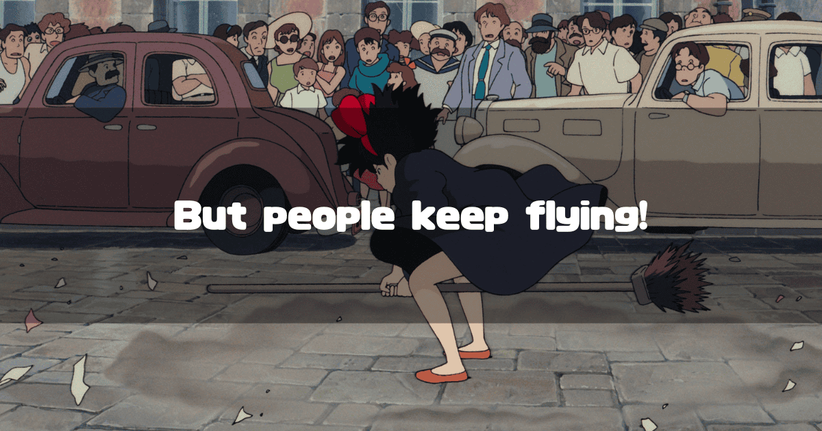 On a cobblestone street, Kiki crouches low on her broom in front of a crowd of onlookers, with the overlaid text "But people keep trying!