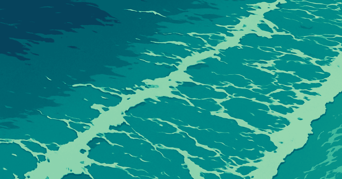 Turquoise ocean surface with white sea foam forming intricate wave patterns