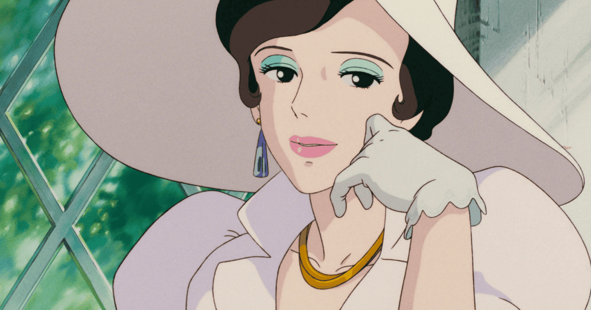 Elegant woman in a wide-brimmed white hat and gloves resting her cheek on her hand beside a sunlit window