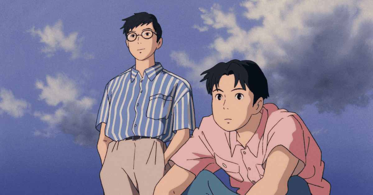 Two young men looking into the distance beneath a cloudy blue sky, one wearing glasses and a striped shirt