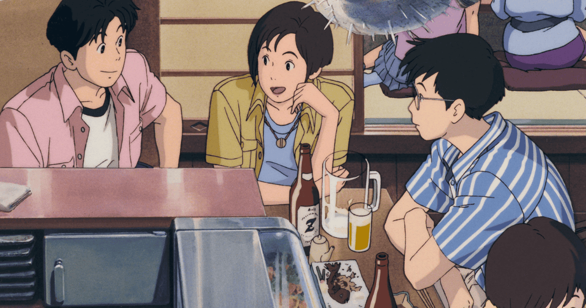 Three young friends talking together over drinks at a casual restaurant table