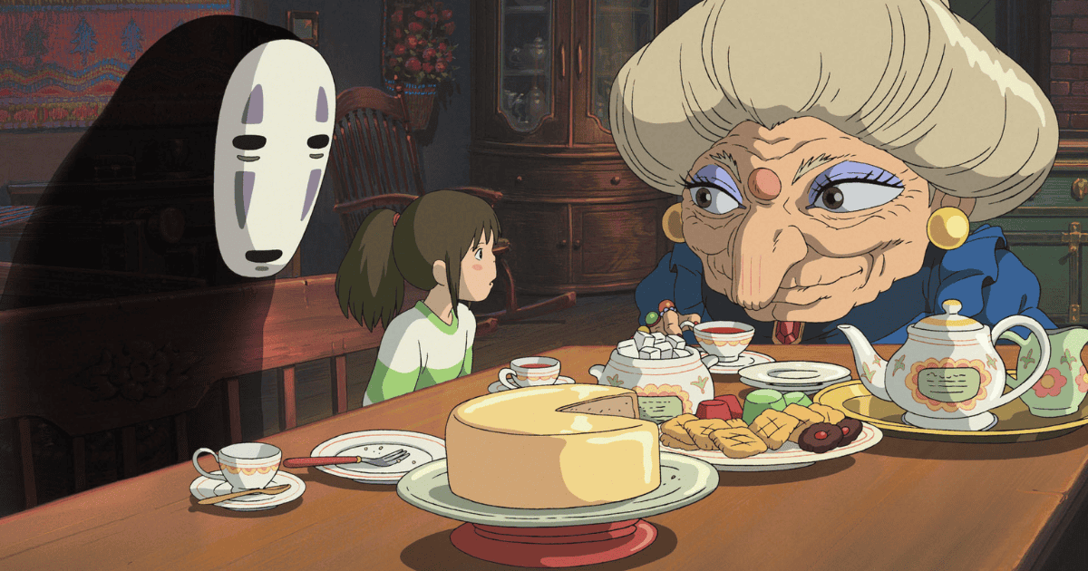 Chihiro sitting at a tea table with Yubaba and No-Face in Spirited Away