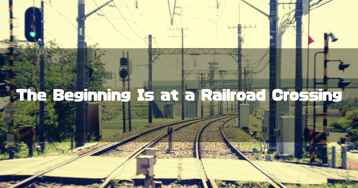 A Headline with a Railroad Crossing in the Background and the Catchphrase ‘The Beginning Is at a Railroad Crossing.’