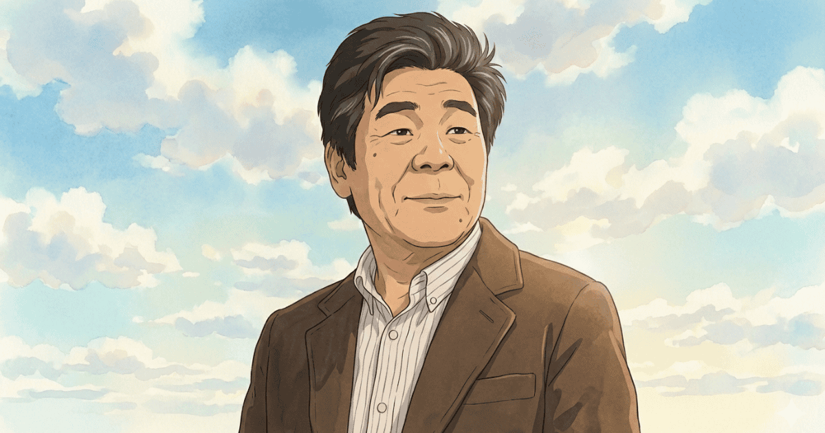 Older Japanese man in a brown jacket standing beneath a bright blue sky with soft clouds