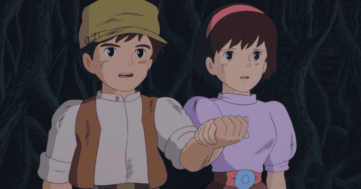 Pazu and Sheeta holding hands in a dark cave in Castle in the Sky