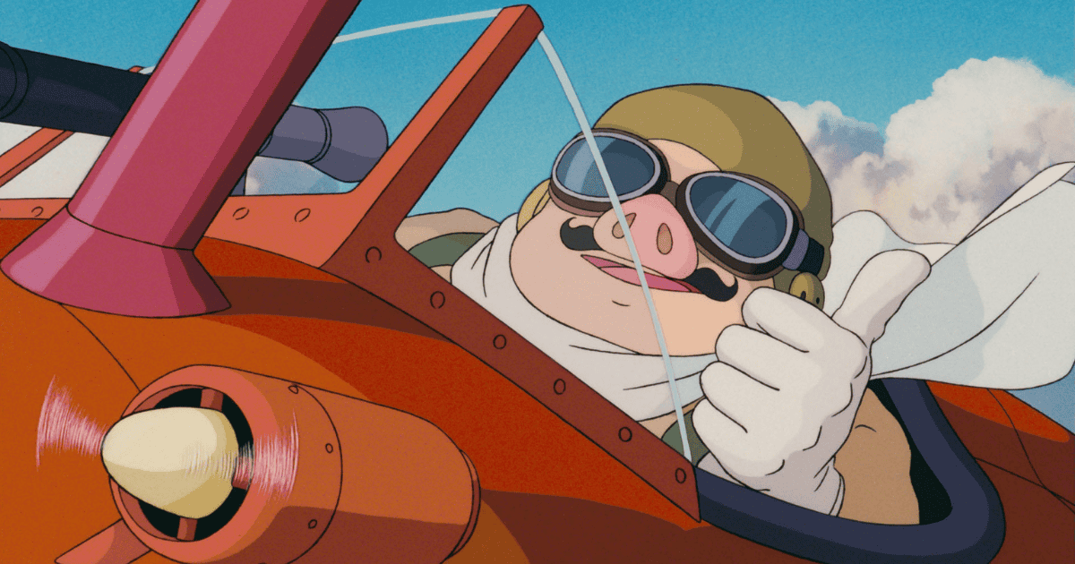 Porco Rosso piloting his red seaplane beneath a bright blue sky in Porco Rosso